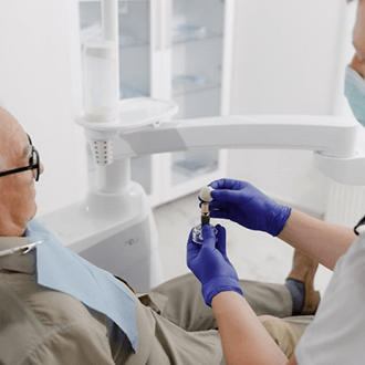 a patient in Springfield learning how dental implants work 