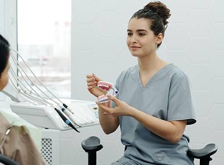 Woman at dentist for a dental bridge in Springfield