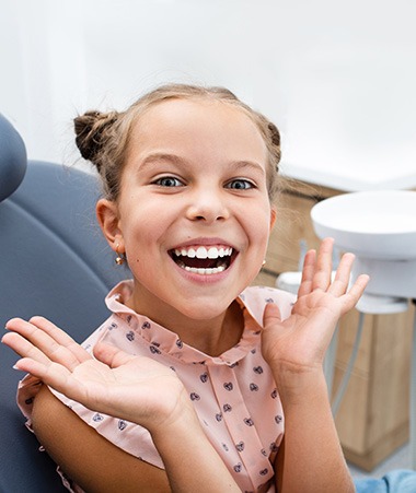 Closeup of child smiling in treatment room