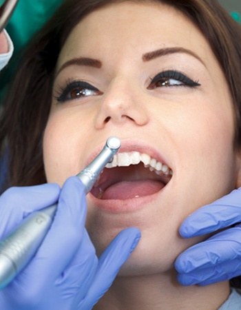 Woman receiving dental cleaning