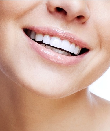 Closeup of healthy flawless smile after dental implant tooth replacement
