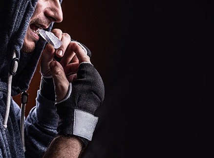 boxer putting in sports mouthguard