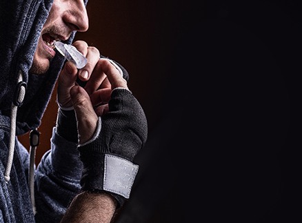 boxer putting in sports mouthguard 