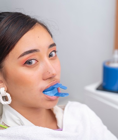 Springfield patient biting down on fluoride trays