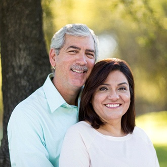 Older couple enjoying the benefits of dental implants in Springfield