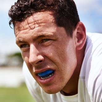 a man wearing a mouthguard for dental implant protection