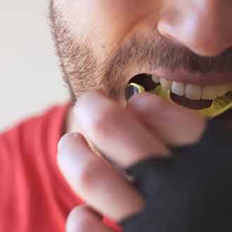 a man wearing a mouthguard for dental implant protection