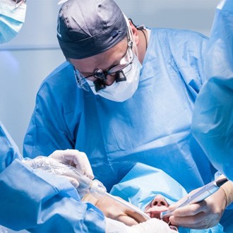 a dentist performing a dental implant procedure