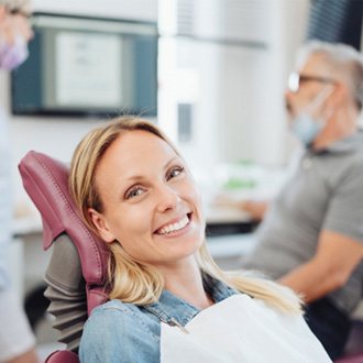 Woman smiling in the dental chair