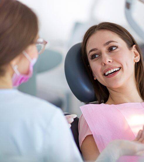 Smiling patient in dental chair