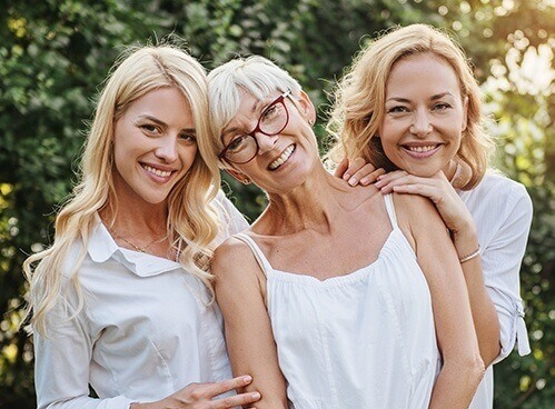 Three generations of family smiling together