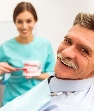 Mature man smiling at dentist appointment