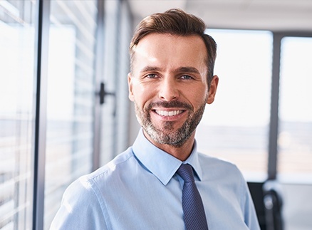 Man with healthy smile after preventive dentistry