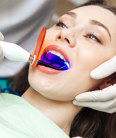 Woman receiving dental sealants