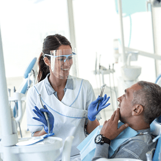 dentist explaining treatment to patient