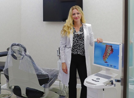 Doctor Henkin next to digital impression system