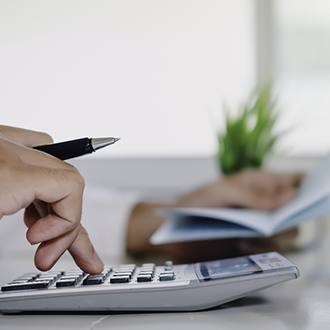 Man calculating cost of veneers in Springfield