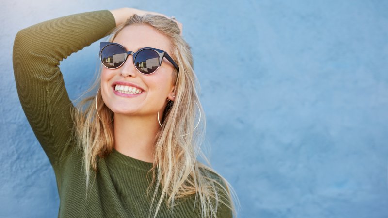 Woman in sunglasses smiling