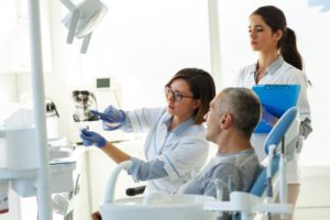 man talking to his dentist about x-ray