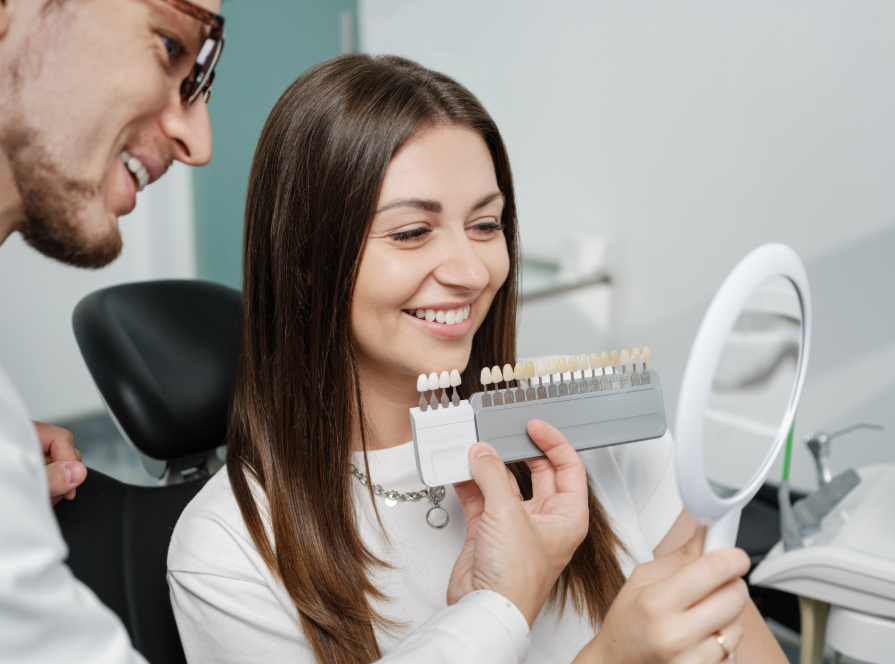 Dentist showing patient veneer options